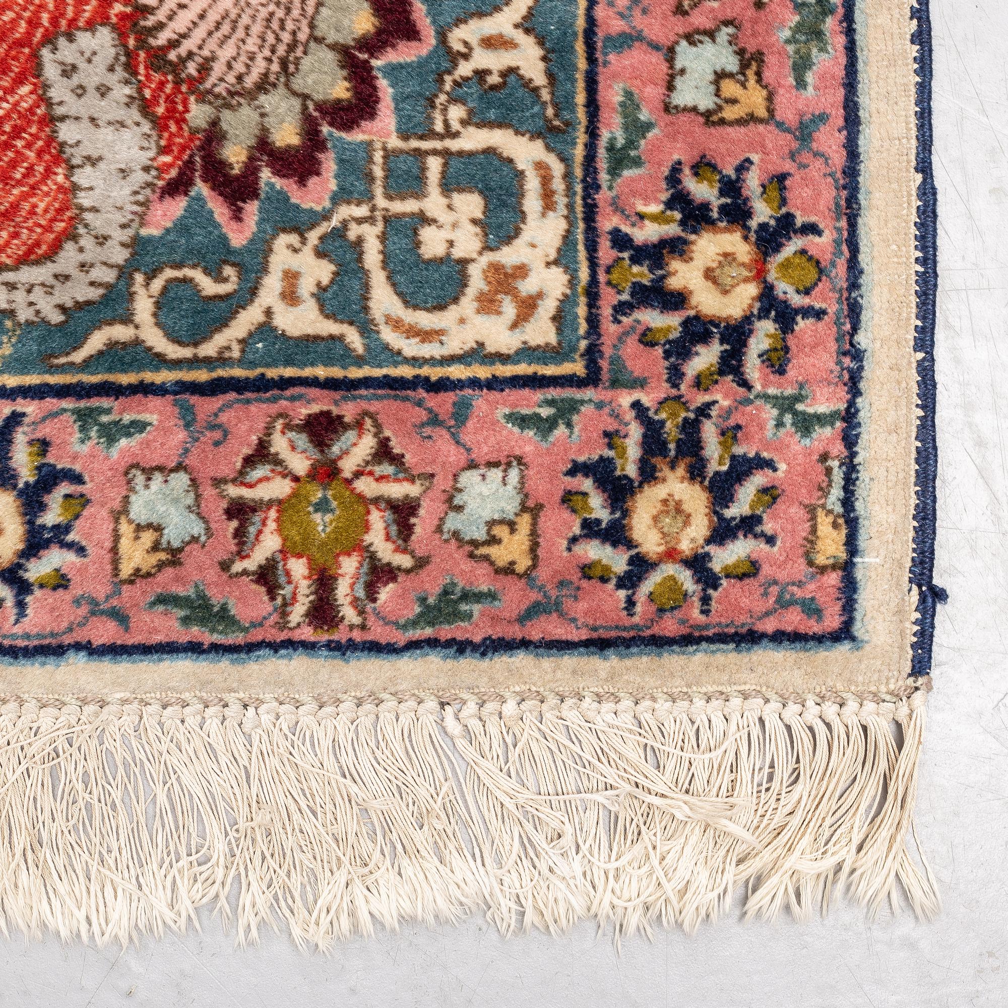 A carpet, a semi-antique Tabriz figural, ca 354,5-362 x 250,5-258 cm.