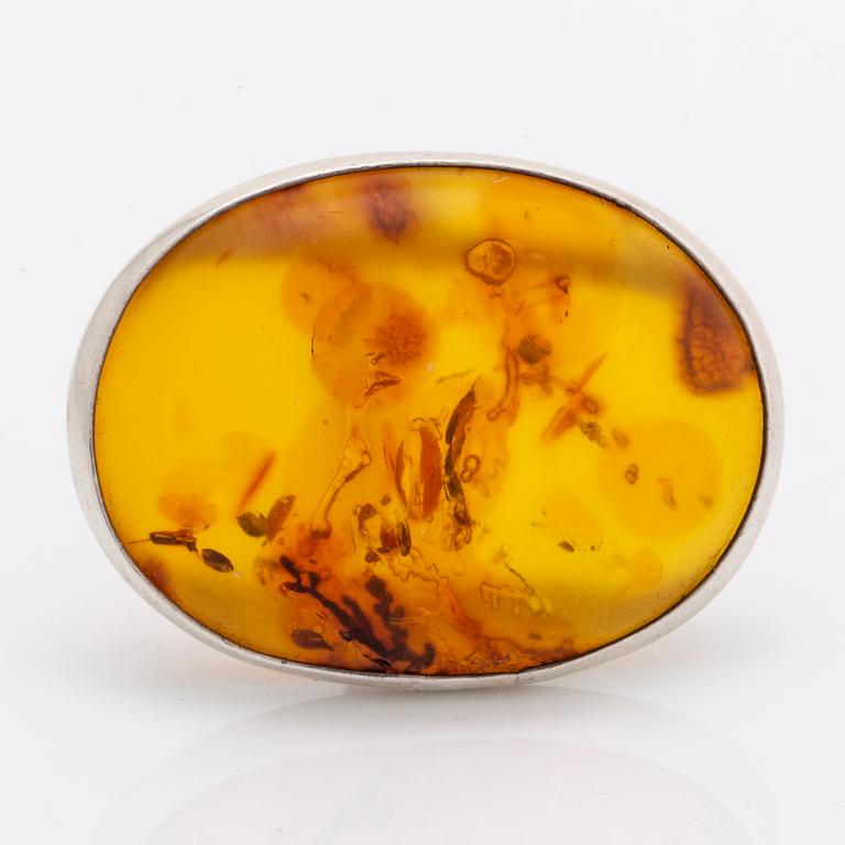 Amber set in silver, pendant, ring and earrings.