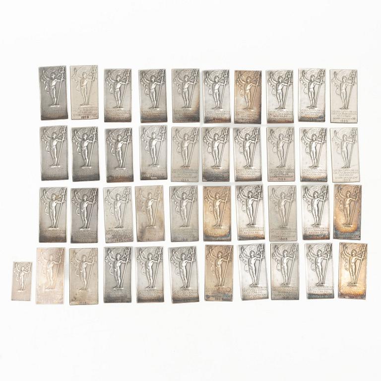 41 silver plaques, “Svenska Gymnastik och Idrottsriksförbund, Distrikts Mästerskap”, CG Hallberg. First half of the 20th century.