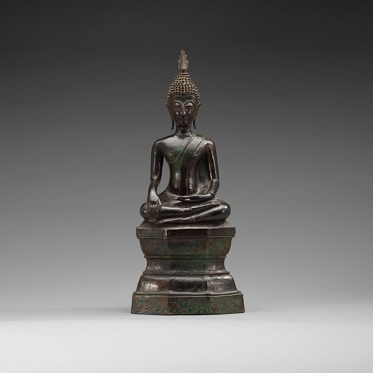 A large seated bronze figure of buddha, Thailand, 19th Century or older. With inscription to base.
