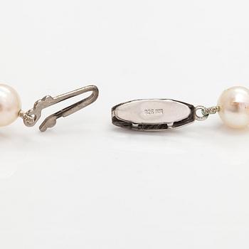 A pearl collier and two-strand pearl bracelet with cultured pearls and sterling silver.