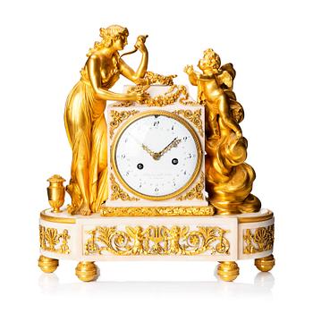 A Louis XVI marble and ormolu mantel clock, late 18th century.