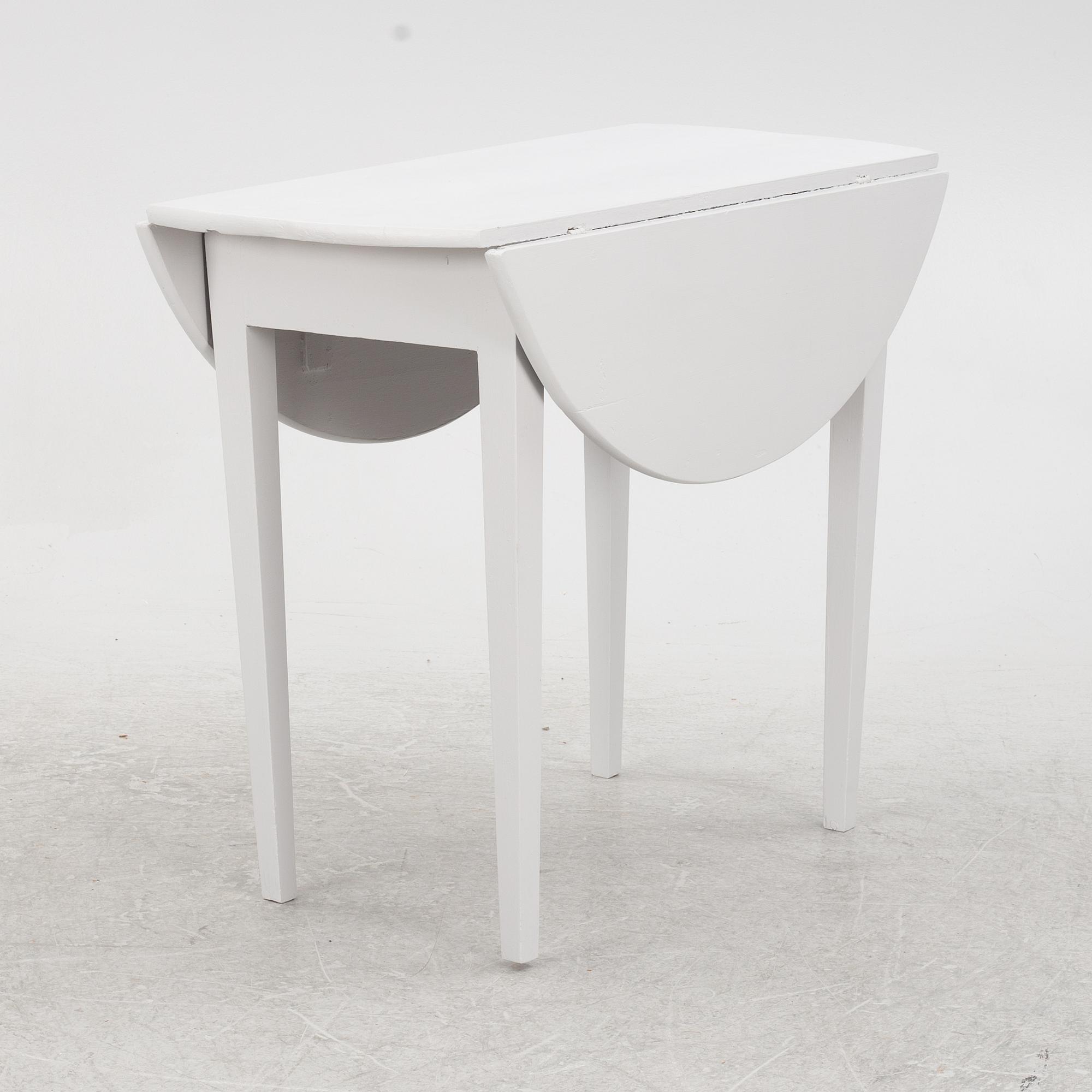 A drop-leaf table, late 19th Century.