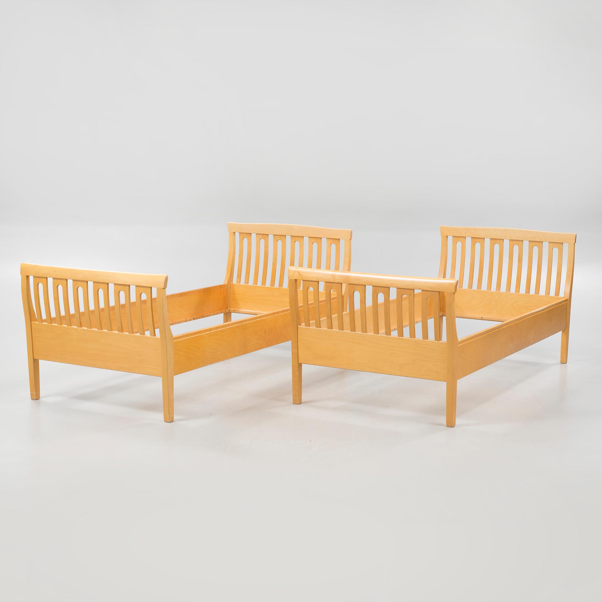 A pair of beds by Carl Malmsten for Åfors Möbelfabrik, second half of the 20th century.