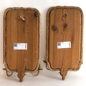 A pair of Swedish 18th century two-light girandole mirros.