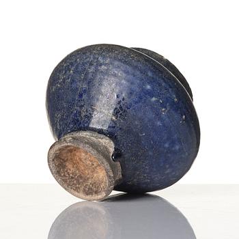 A blue-glazed Nishapur pottery Jug, Persia, 13th century.