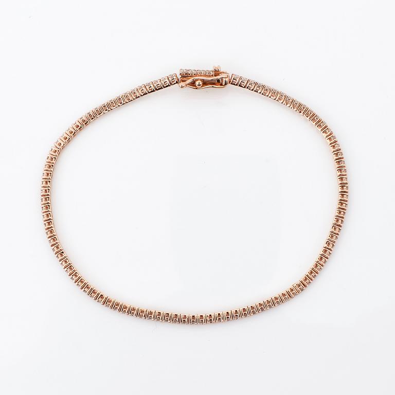 ARMBAND, ett riviére i rosa guld med briljanter, totalt ca 0.99ct.