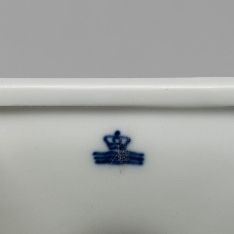 A white glazed Royal Copenhagen porcelain nodding head figure, Denmark, early 20th Century. Not first quality.