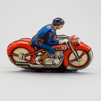 A tinplate synchronous motorcycle by Philipp Niedermeier, Germany, 1950s.