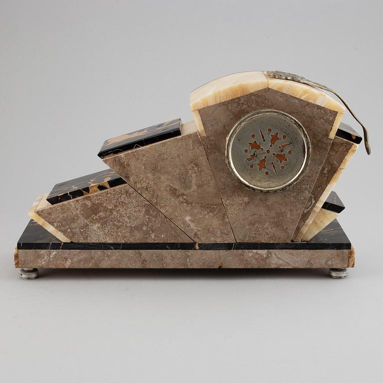 A three piece clock garniture, Art Deco style, 20th Century.