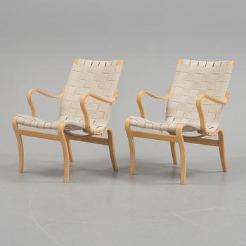 a pair of "Mina" armchairs by Bruno Matsson.