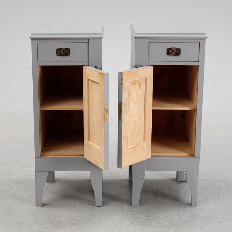 A pair of painted bedside tables stands. First half of the 20th century.
