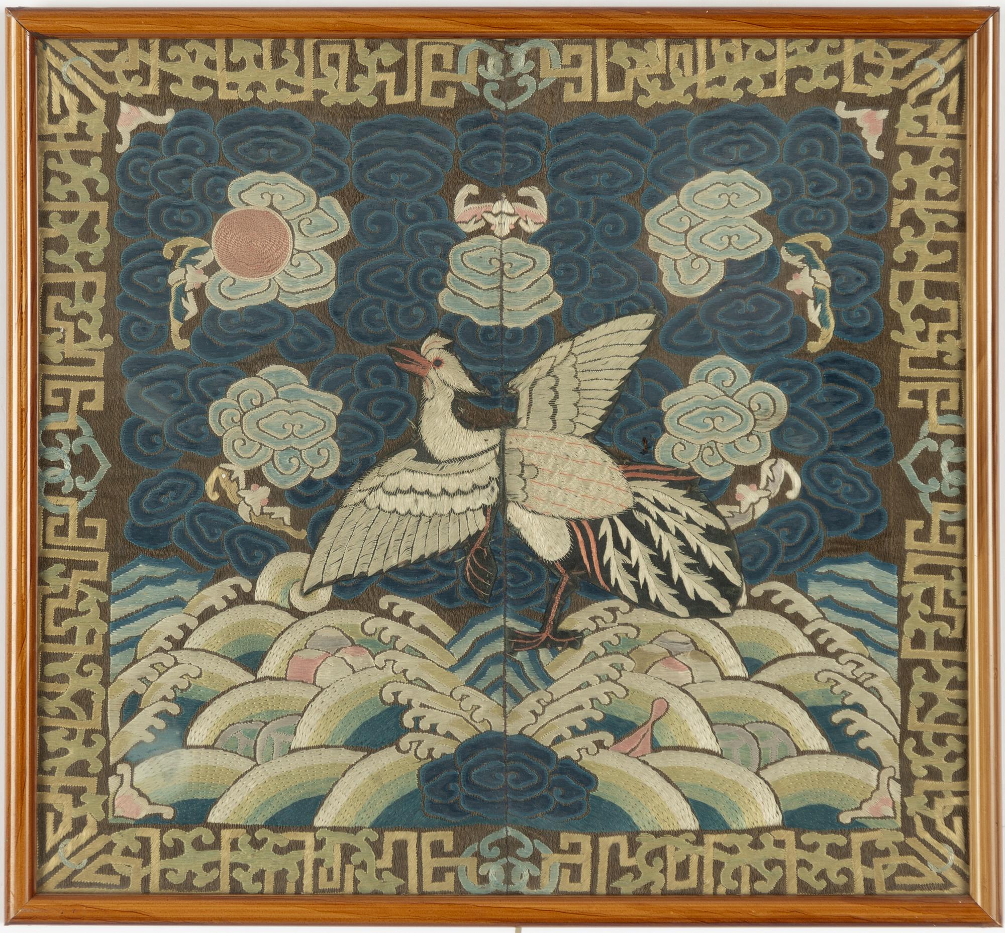 An embroidered civil official's rank badge with a bird, 'buzi', Qing dynasty.