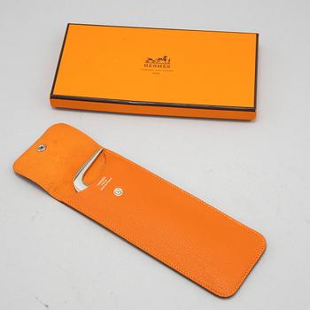 Hermès, hoof pick.