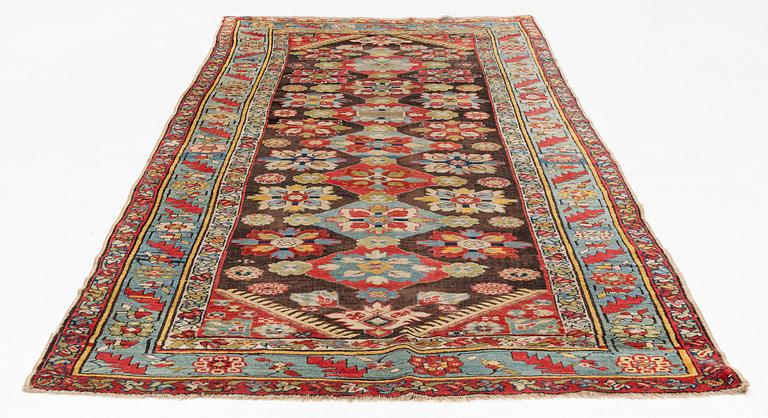 An antique Karabagh carpet,  ca 330 x 157 cm (one end with 1-3 cm flat weave).