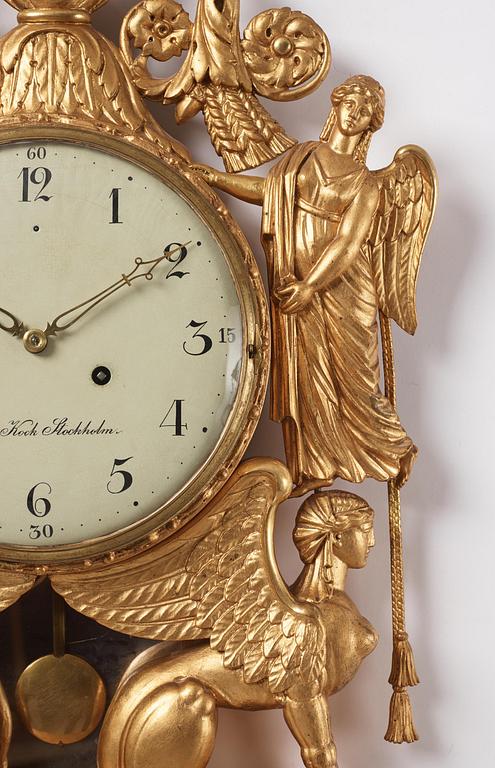 A late Gustavian giltwood cartel clock by J. Kock (royal watchmaker, active 1762-1803).