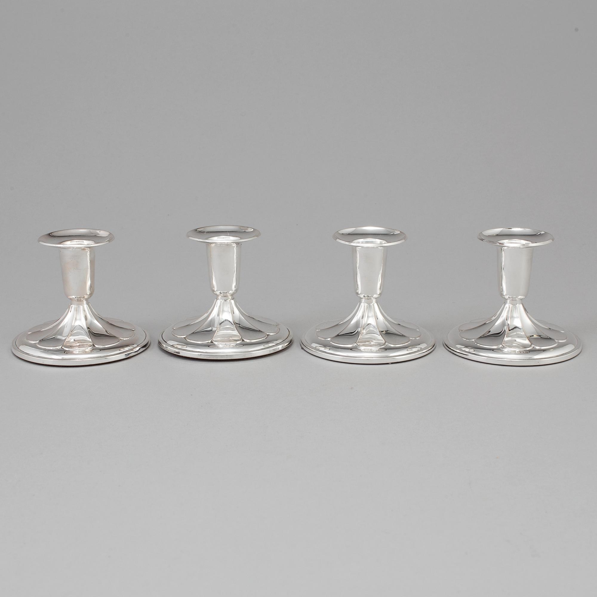 A set of four silver Candlesticks,