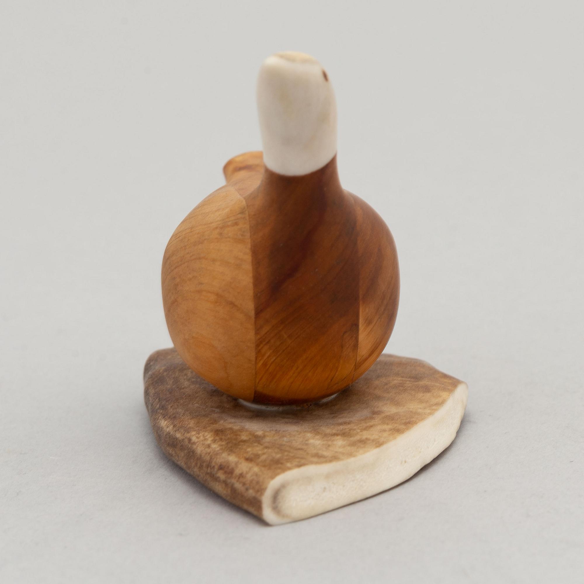 Lars Levi Sunna, a reindeer horn and birch figurine of a grouse, signed.