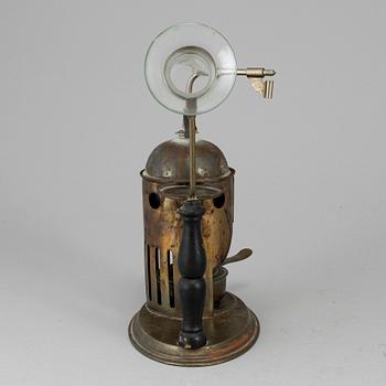 A tinplate burner, 20th century.