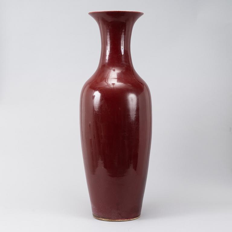 A massive red Chinese porcelain floor vase, modern production.