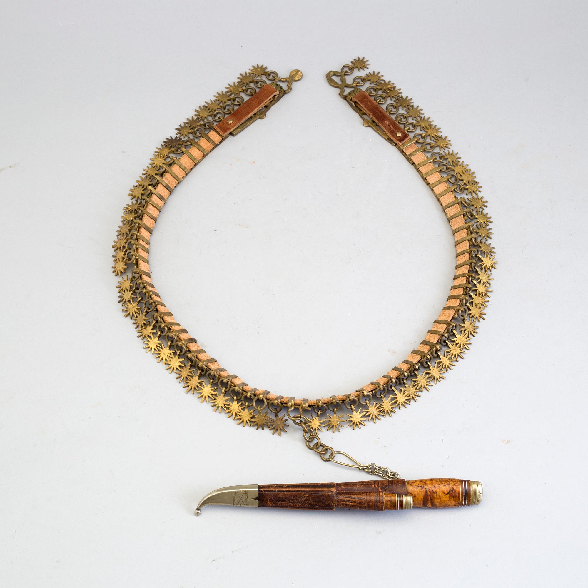 a brass and leather belt by Gustav Blomqvist 19th/20th century.