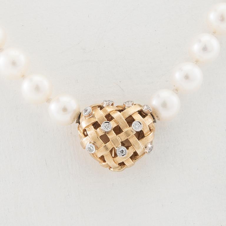 Ole Lynggaard, Necklace of cultured pearls, clasp with a key function in 18K gold and diamonds, design by Charlotte Lynggaard.