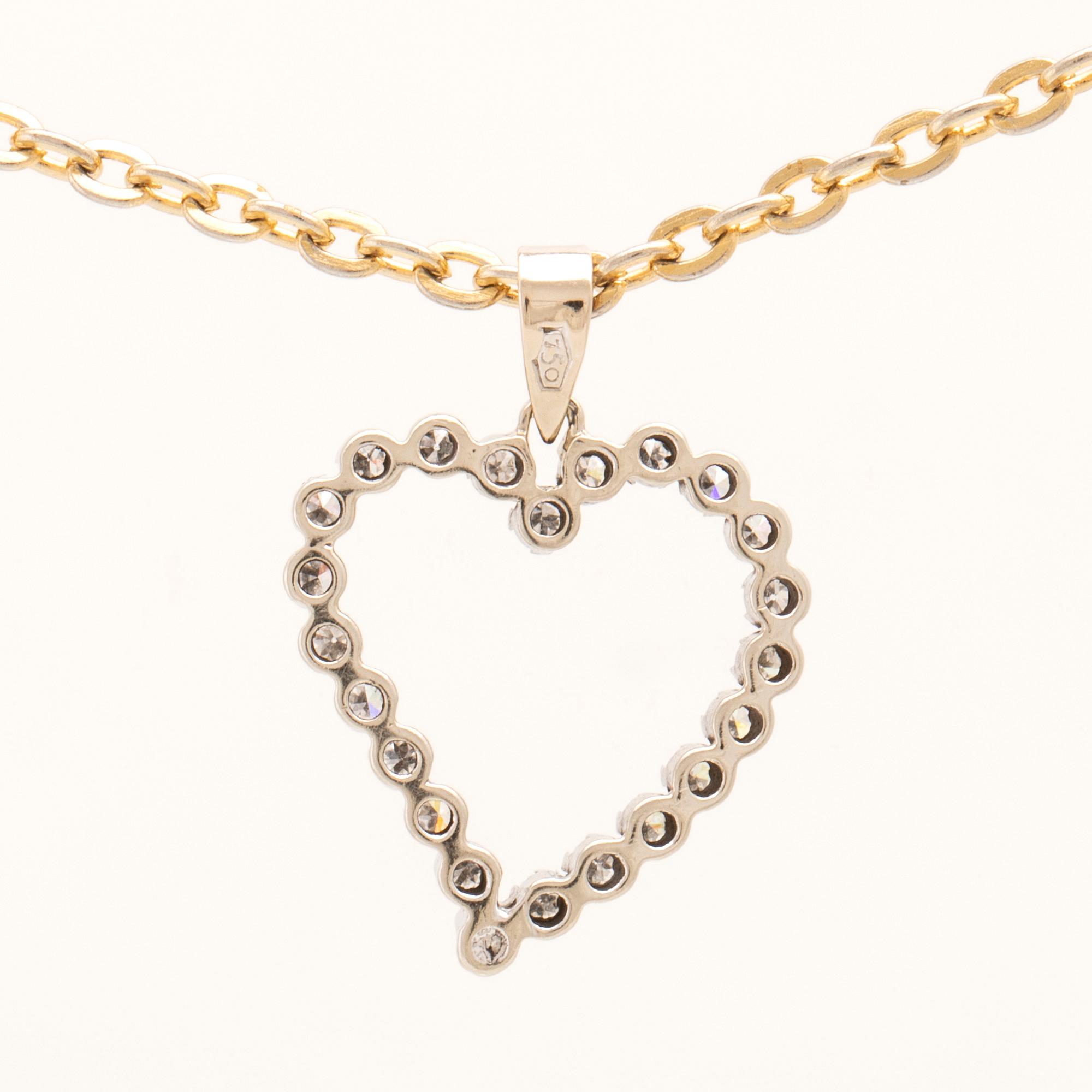 Pendant in 18K white gold with round single-cut diamonds.