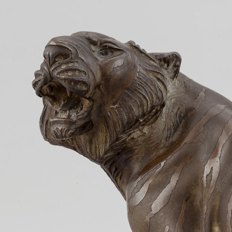 A Japanese bronze okimono in the shape of a tiger, Meiji period (1868-1912), late 19th century. Signed 'Mitani'.