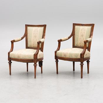 A pair of late Gustavian open armchairs, Stockholm, late 18th century.