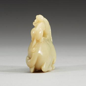 A nephrite figure of a reclining horse with a monkey, China.