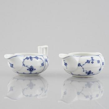 Two 'Musselmalet' porcelain creamers, Royal Copenhagen, one model 55, 19th century.