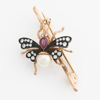 Brooch in the shape of a butterfly, silver and gold with pearl, ruby, and brilliant-cut diamonds.