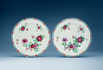 1586. A pair of famille rose chargers, Qing dynasty, Qianlong (1736-95).