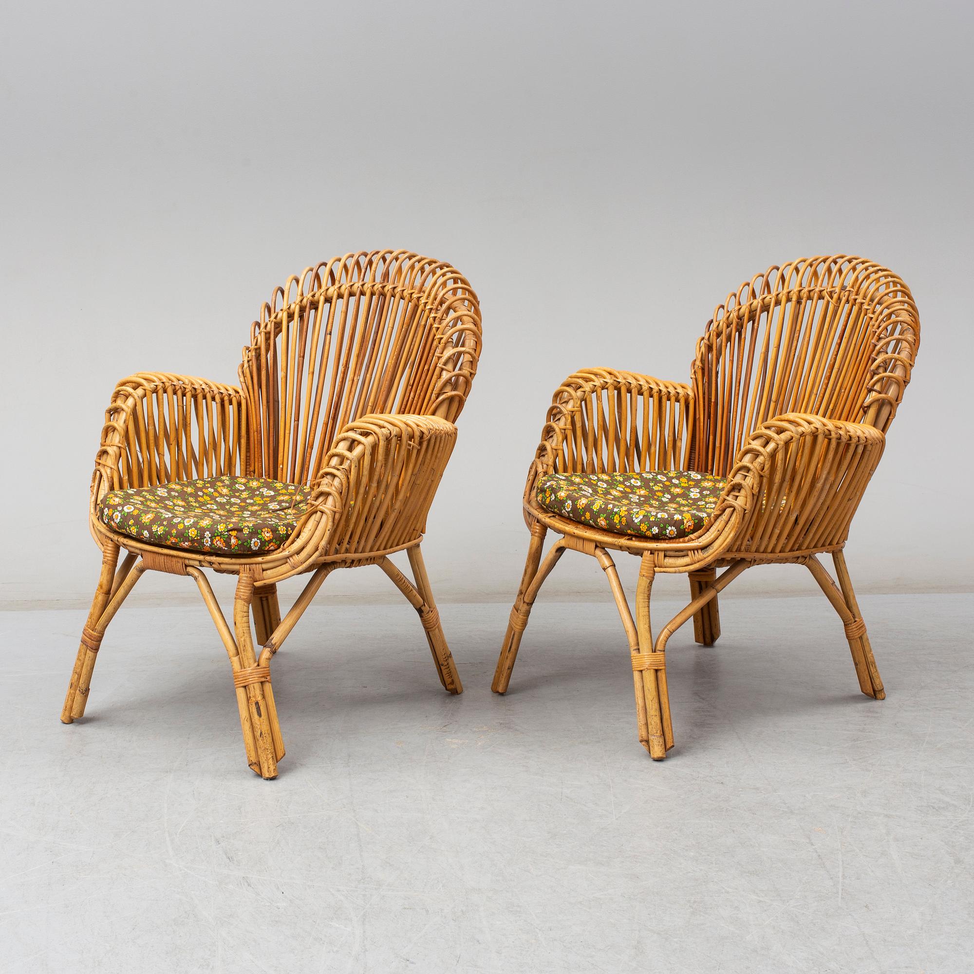 A pair of rattan armchairs, Emilio Paoli, via Vigna Nuova, 8, Firenze, Italy, second half of the 20th century. Signed.