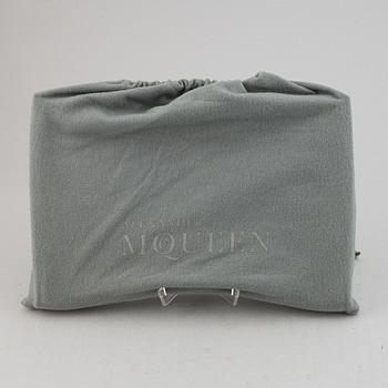 Alexander McQueen, a fabric clutch.