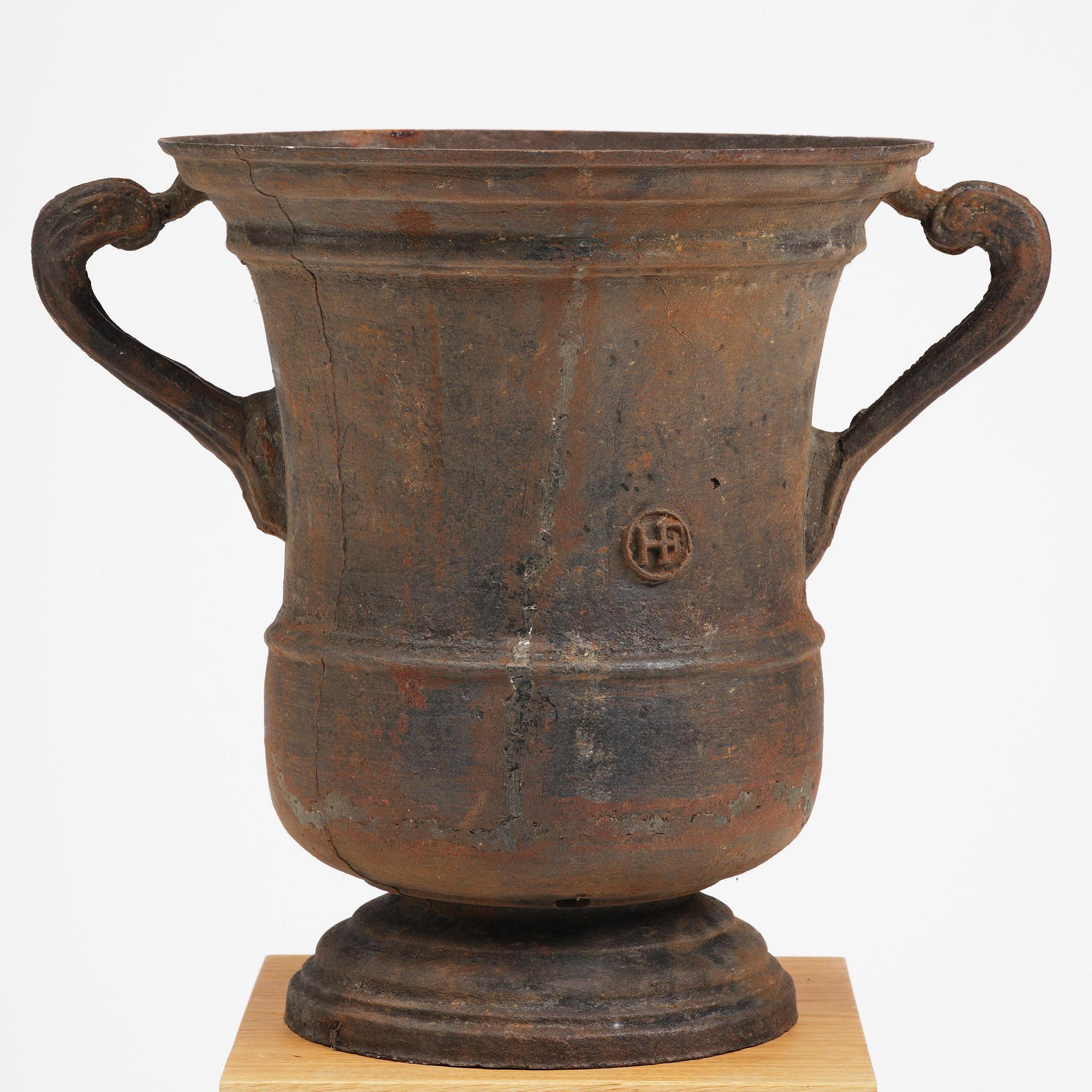 A cast-iron garden urn from Hellefors styckebruk, dated 1791.