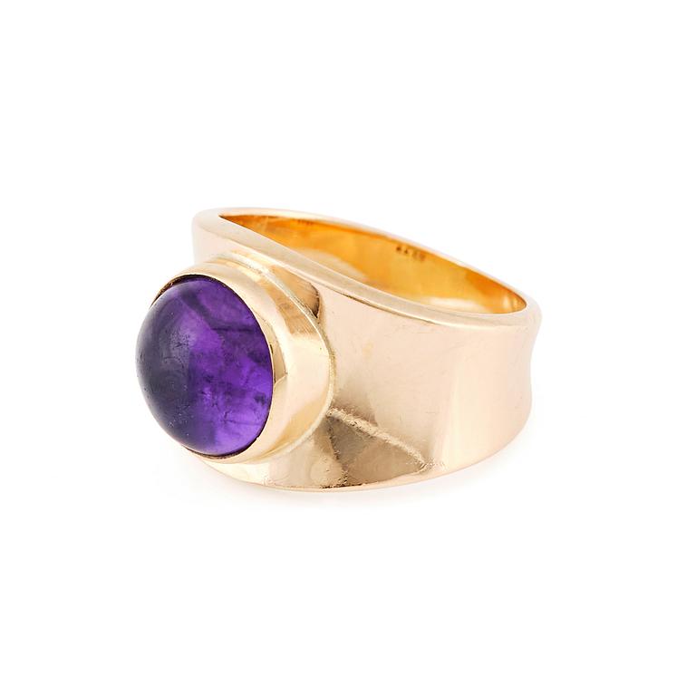 Georg Jensen, an 18K gold ring set with a cabochon-cut amethyst, Copenhagen post 1945, design nr 1124.