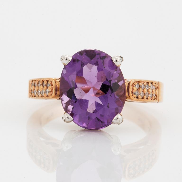 Oval faceted amethyst and brilliant-cut diamond ring.