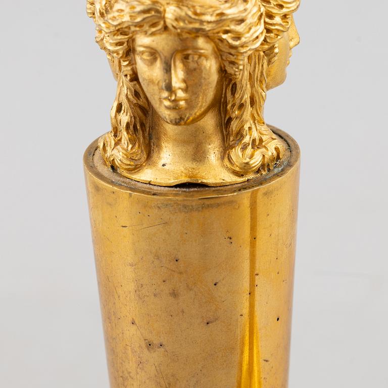 A pair of gilt-bronze Emnpire style candlesticks in the manner of Claude Galle, 19th century.