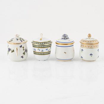 A set of nine Austrian and French custard cups with covers, 19th/20th Century.