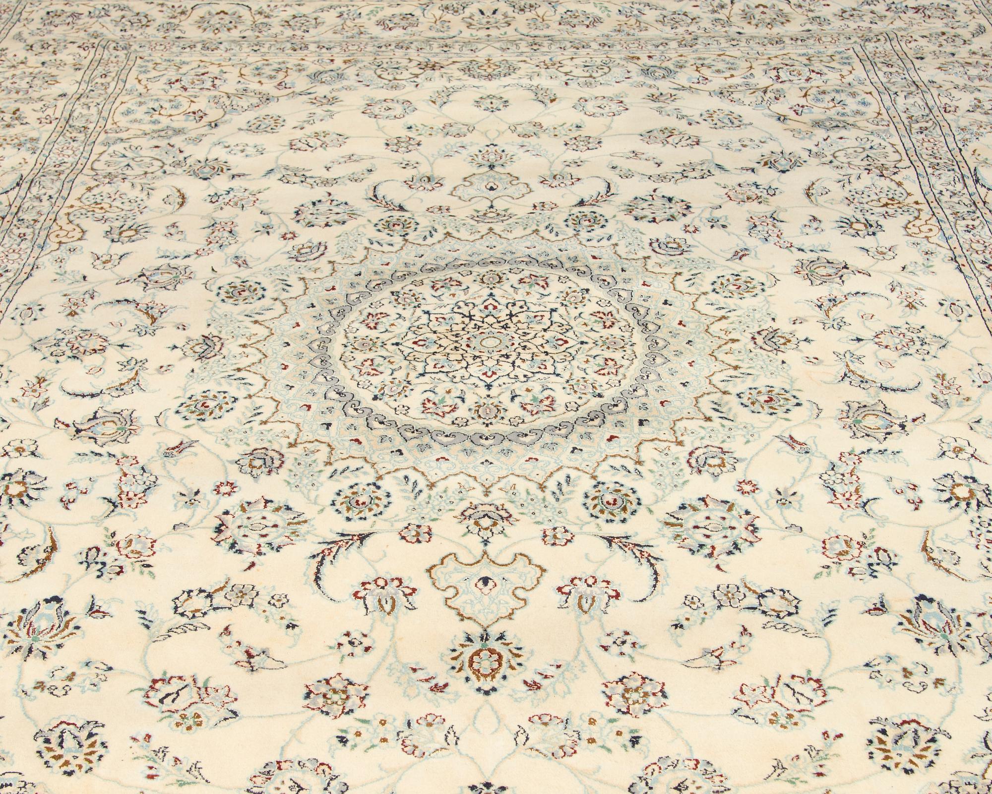 A carpet, Nain, part silk s.k 9LAA. Circa 376 x 249 cm.