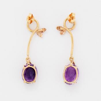 Oval briolette cut amethyst and brilliant-cut diamond earrings.