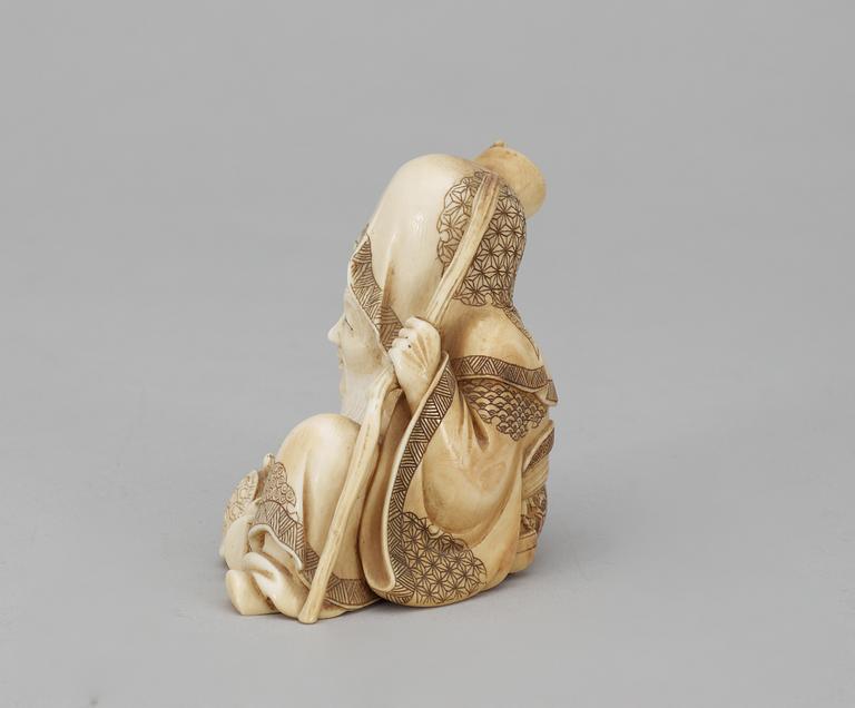 A Japanese ivory okimono figure of Sholaou, Meiji period.