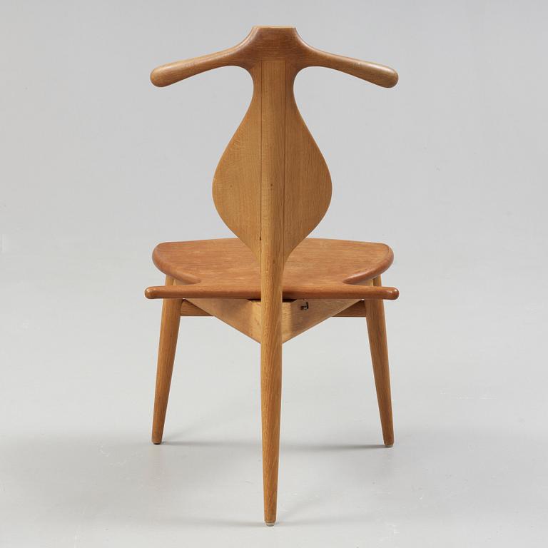 A Hans J Wegner 'Jakkens Hvile' teak chair, Johannes Hansen, Denmark.