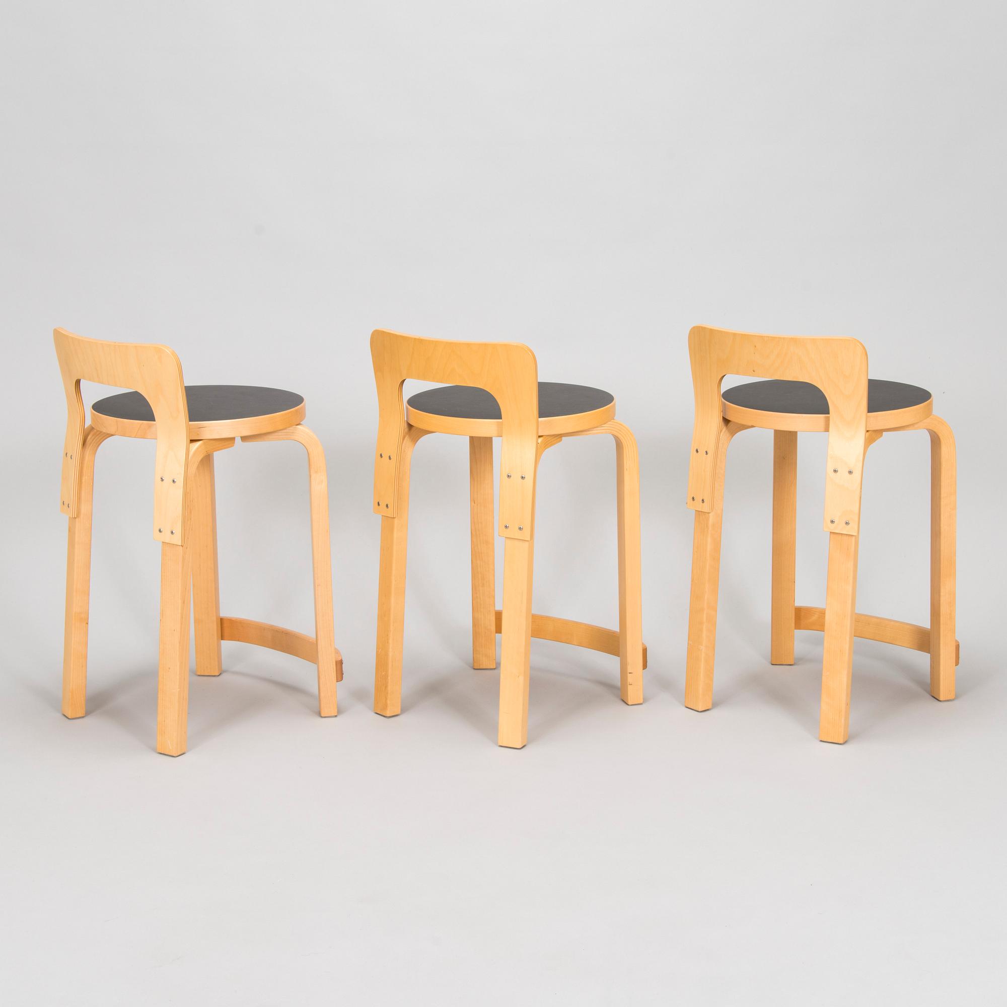Alvar Aalto, a table and three chairs, Artek 2006 and 2007.