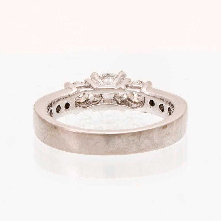 An 18K white gold ring set with round brilliant cut diamonds.