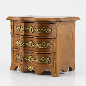 A late Baroque walnut-veneered miniature commode, 20th century.