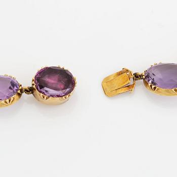 A 14K gold and amethyst necklace.