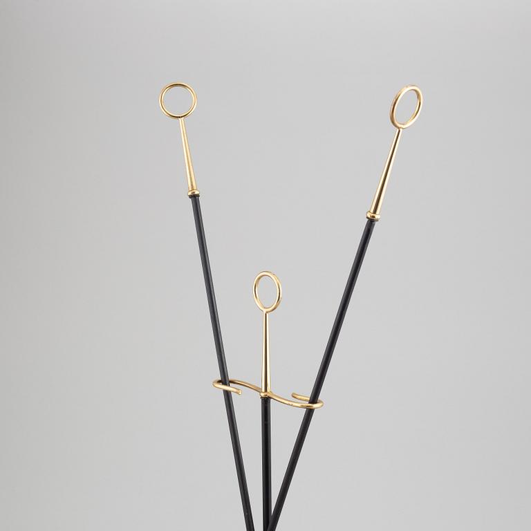 A fireplace stand of three parts by Gunnar Ander for Ystad Metall.