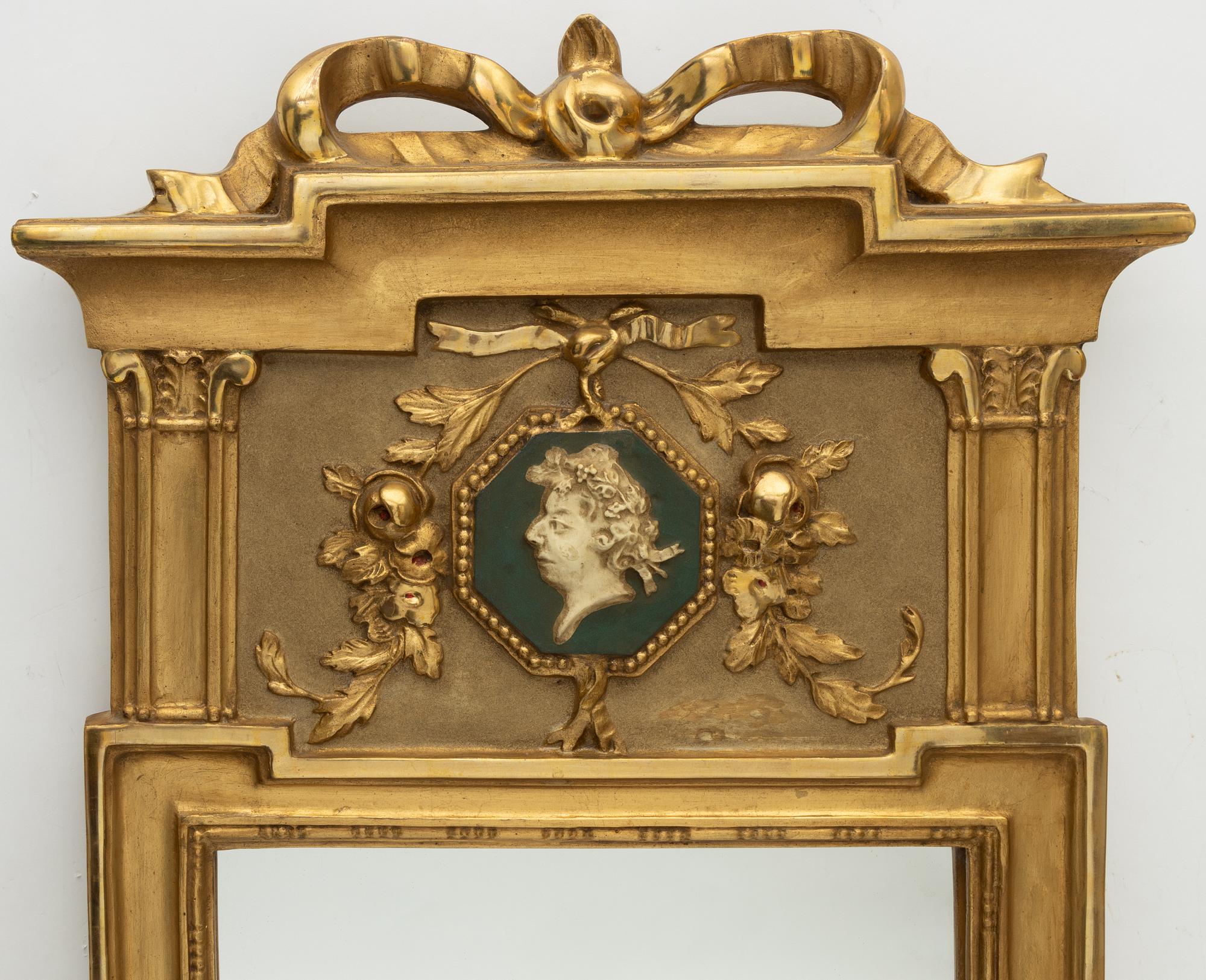 A Gustavian style mirror, mid-20th century.